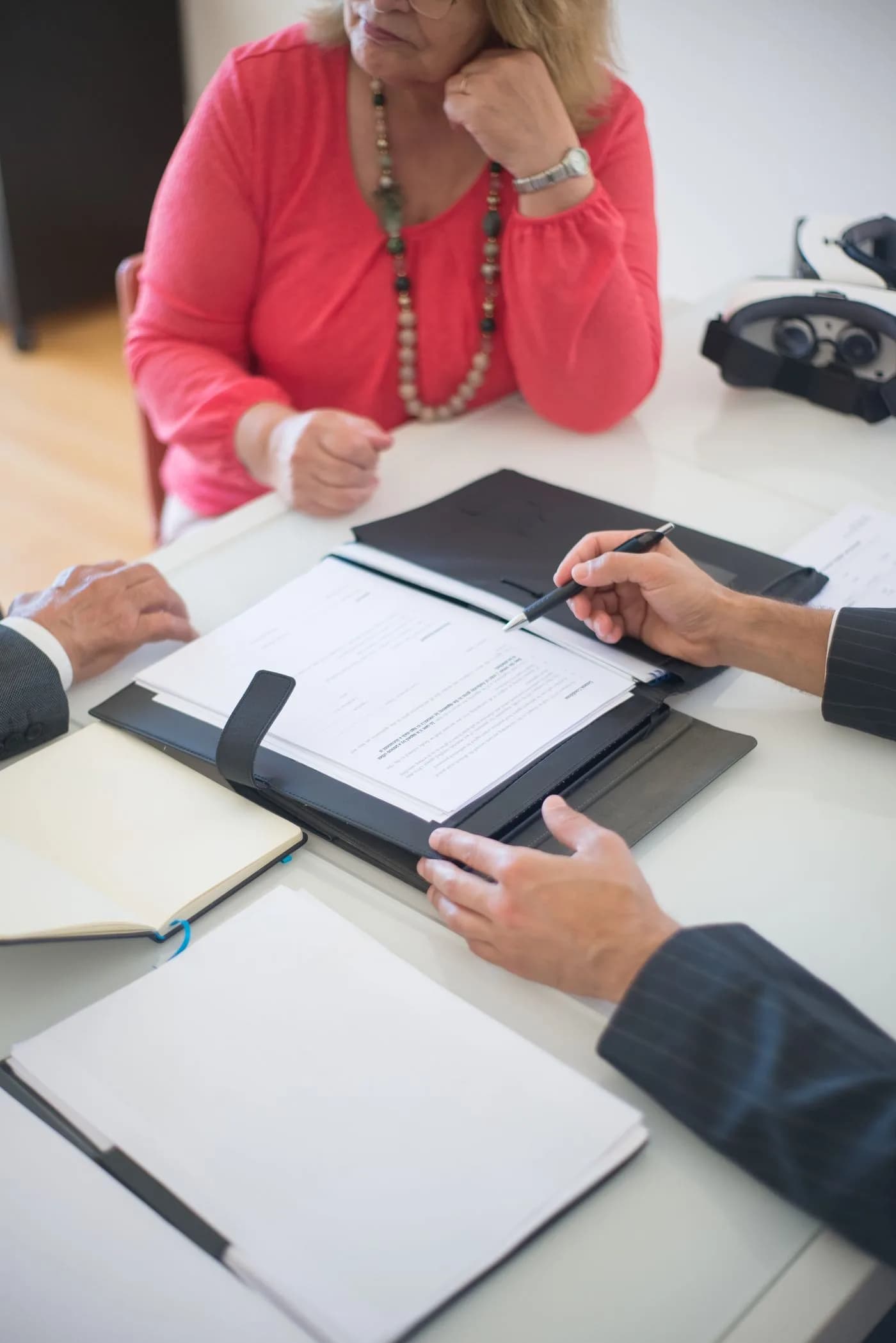 Property professional discussing paperwork with a couple