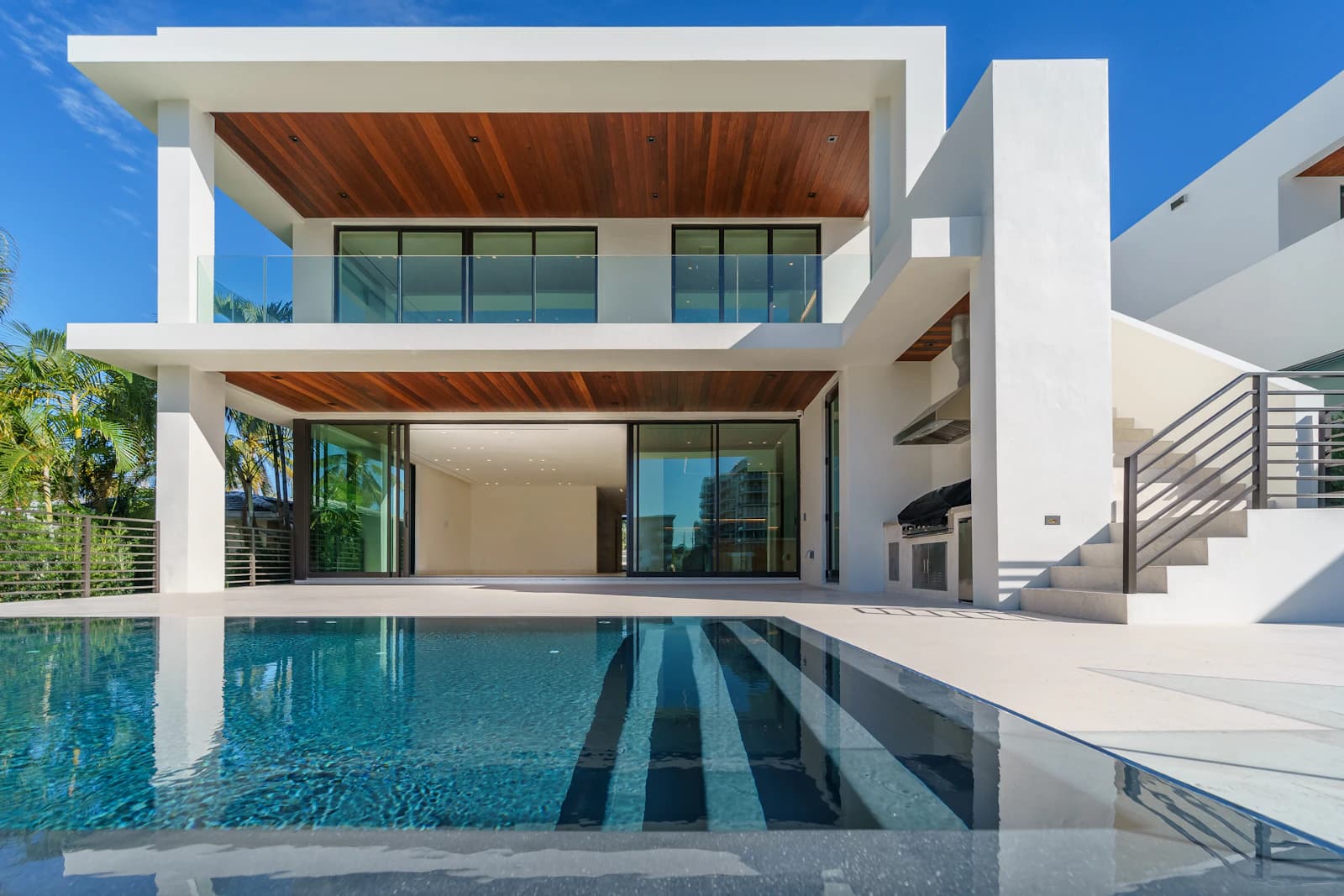 Contemporary white residence with a pool and open terrace