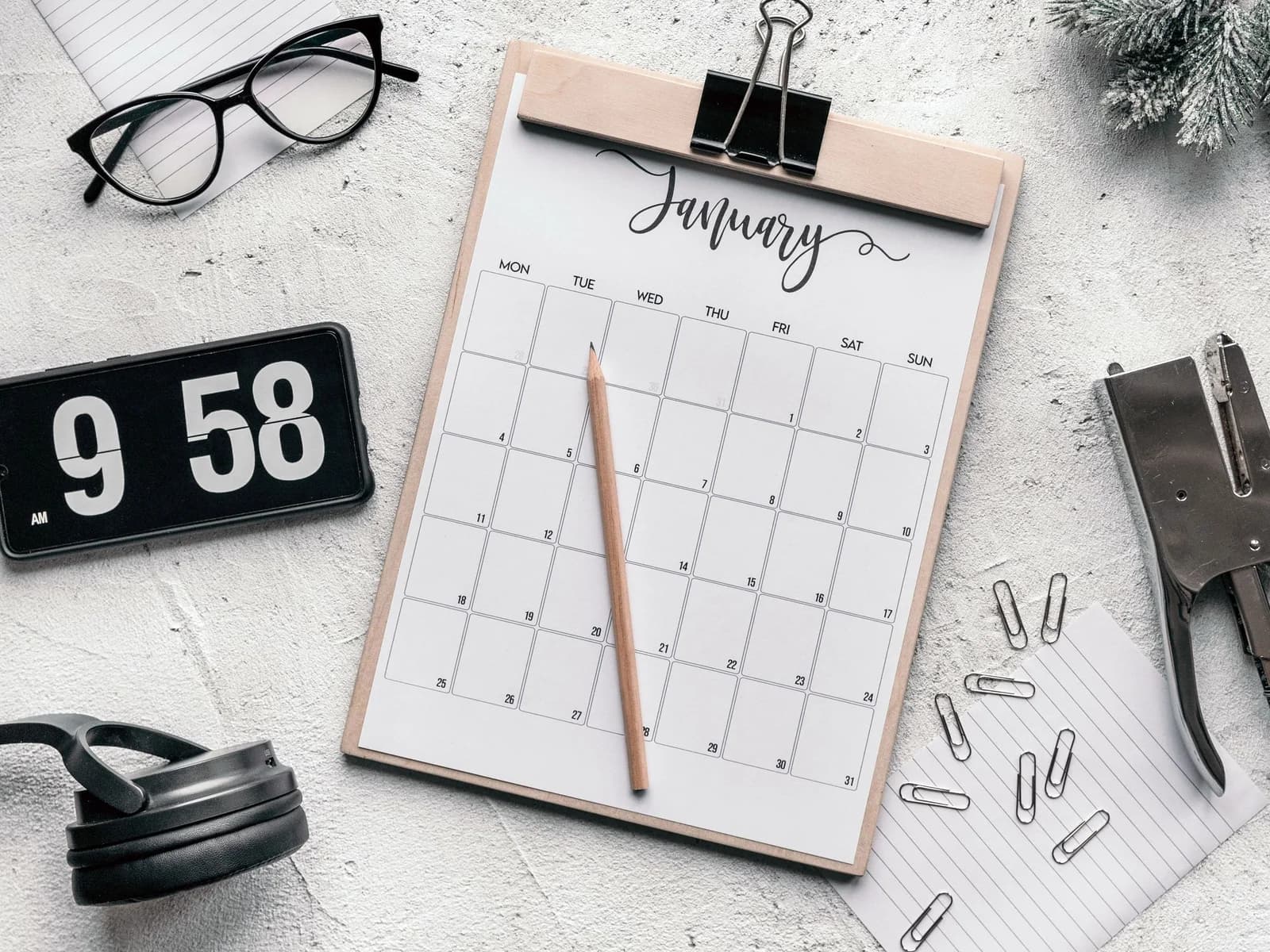 Calendar and stationery arranged for scheduling