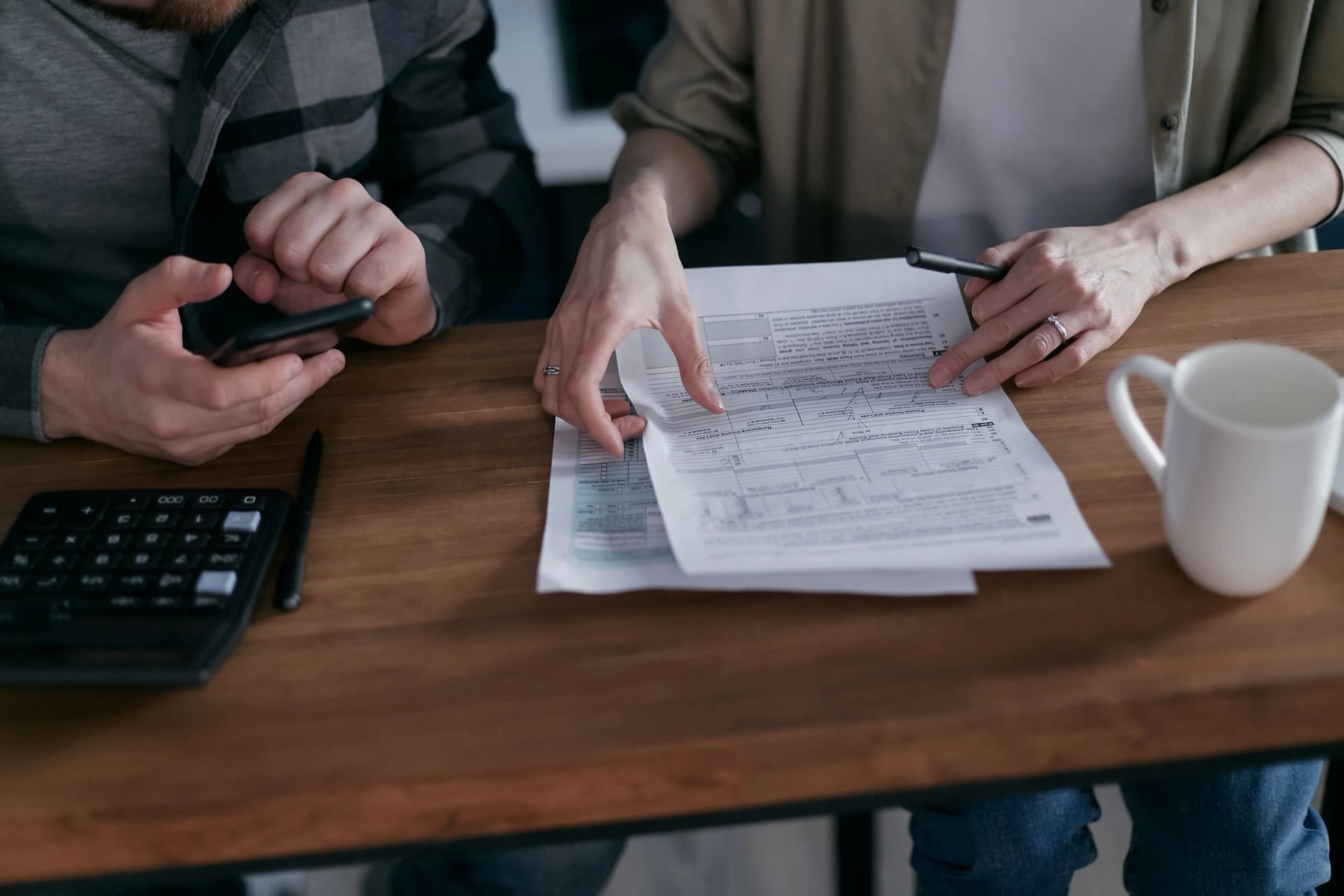 Two people reviewing a document at a table