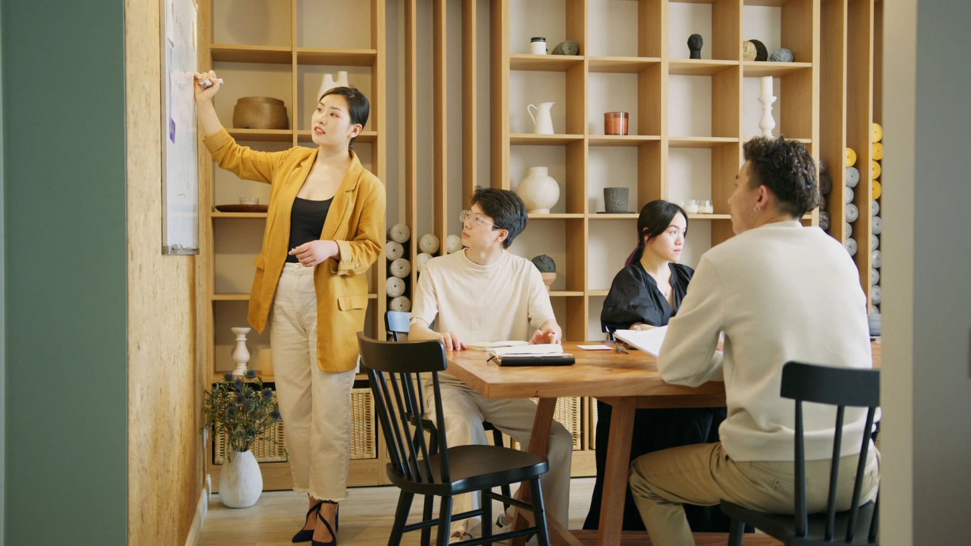 Team discussing a project in a bright meeting room